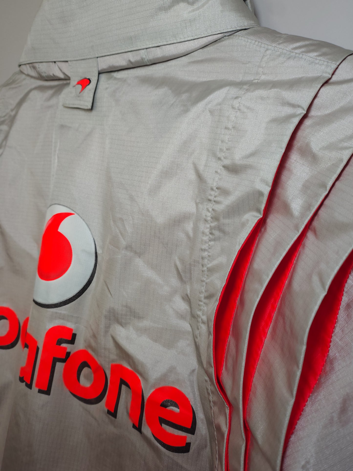 Official Vodafone McLaren Mercedes silver team mens rain jacket BNWT Lewis Hamilton